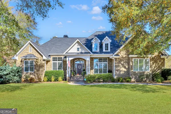 front view of a house with a garden