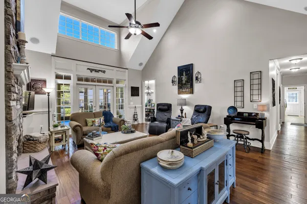a living room with furniture or couch and a wooden floor