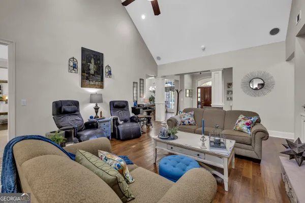 a living room with furniture and a fireplace