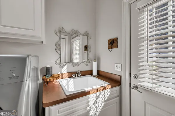 a view of a storage and utility room with washer and dryer