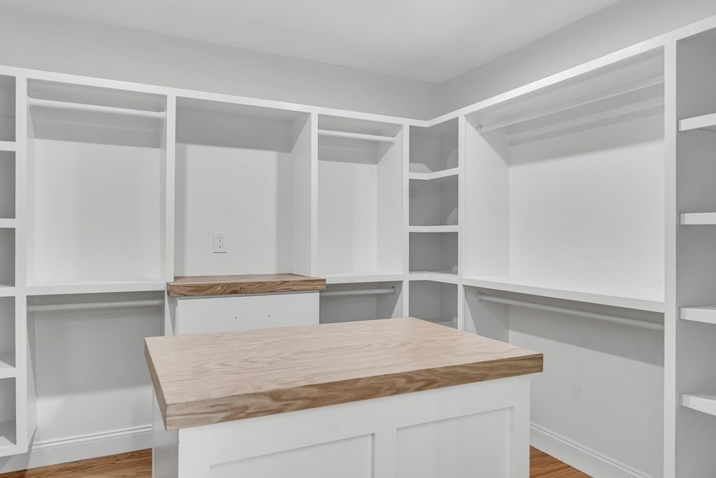 19 Patterson Road Lexington, MA 02421 - Photo 23 of 42 a bathroom with a granite countertop sink and white cabinets