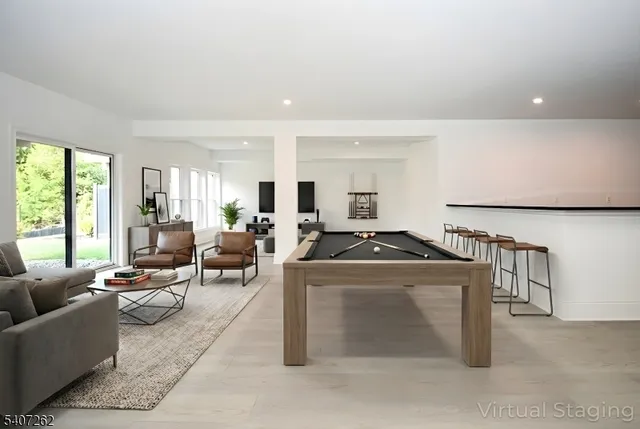 a living room with furniture a large window