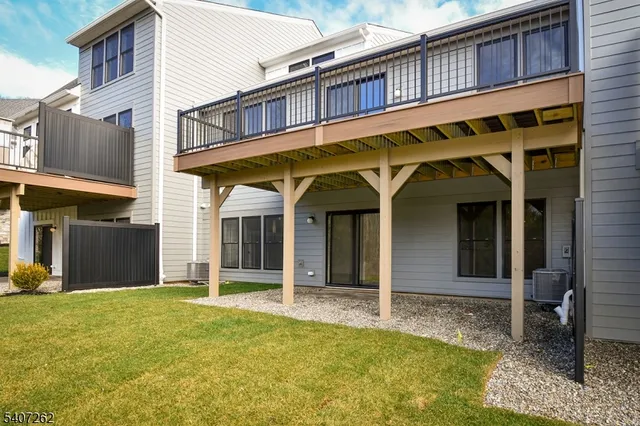 a view of a white building with large windows