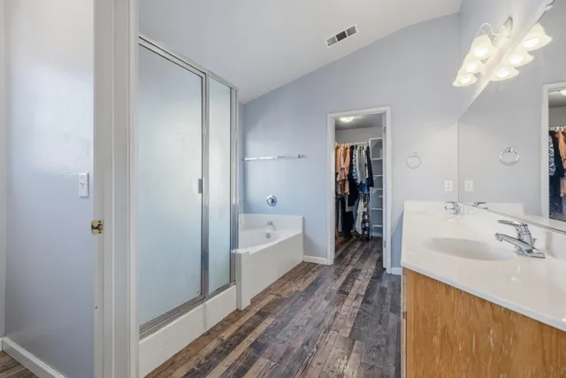 a bathroom with a bathtub and a sink