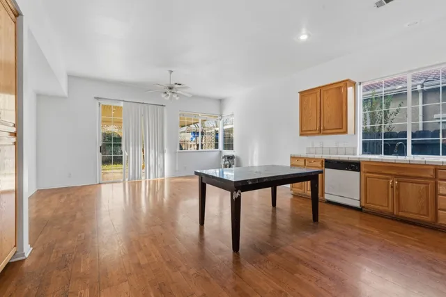 a workspace with furniture window and wooden floor