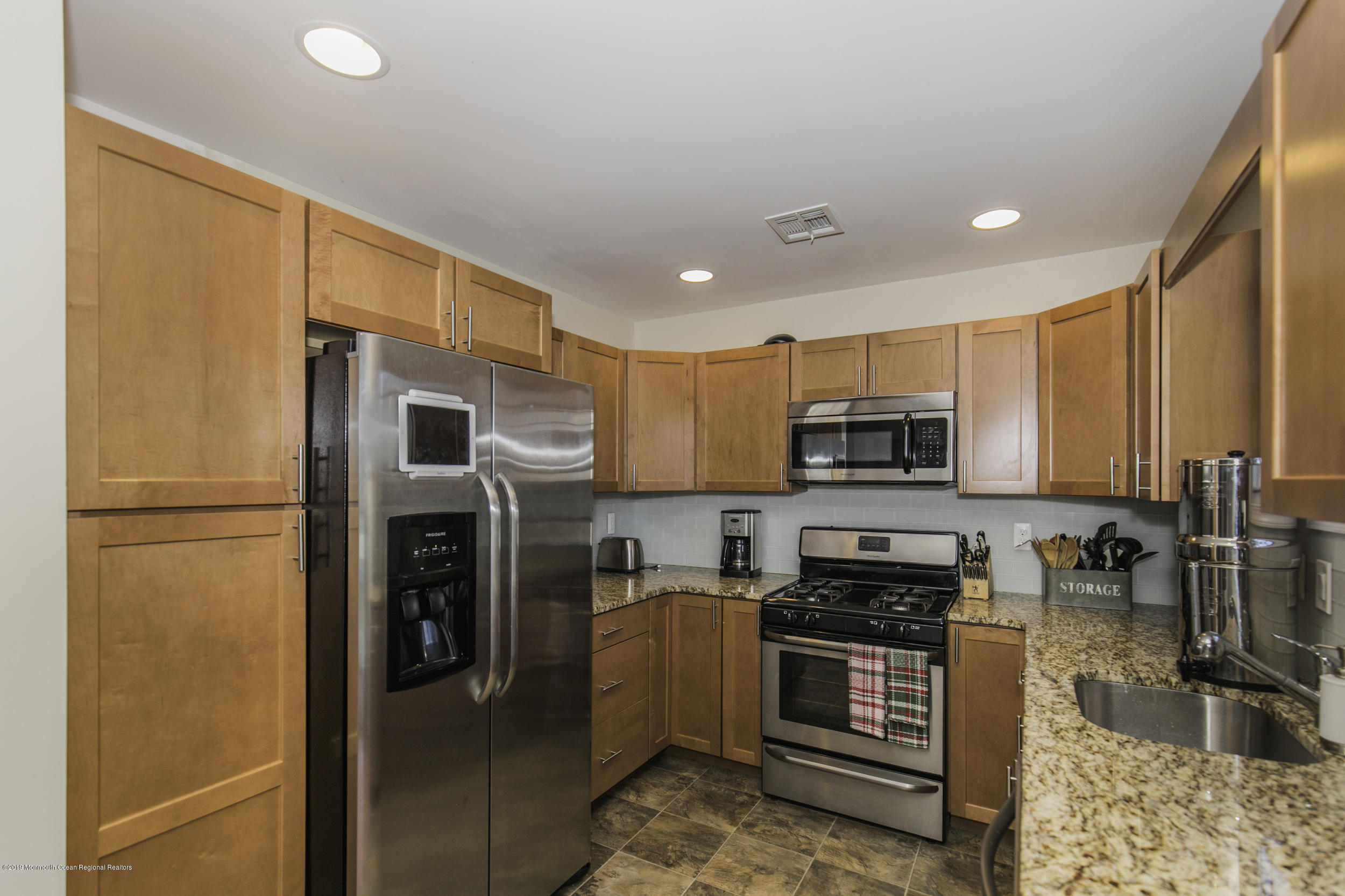 15 Seagoin Road Brick, NJ 08723 - Photo 11 of 32 a kitchen with stainless steel appliances granite countertop a refrigerator stove and oven