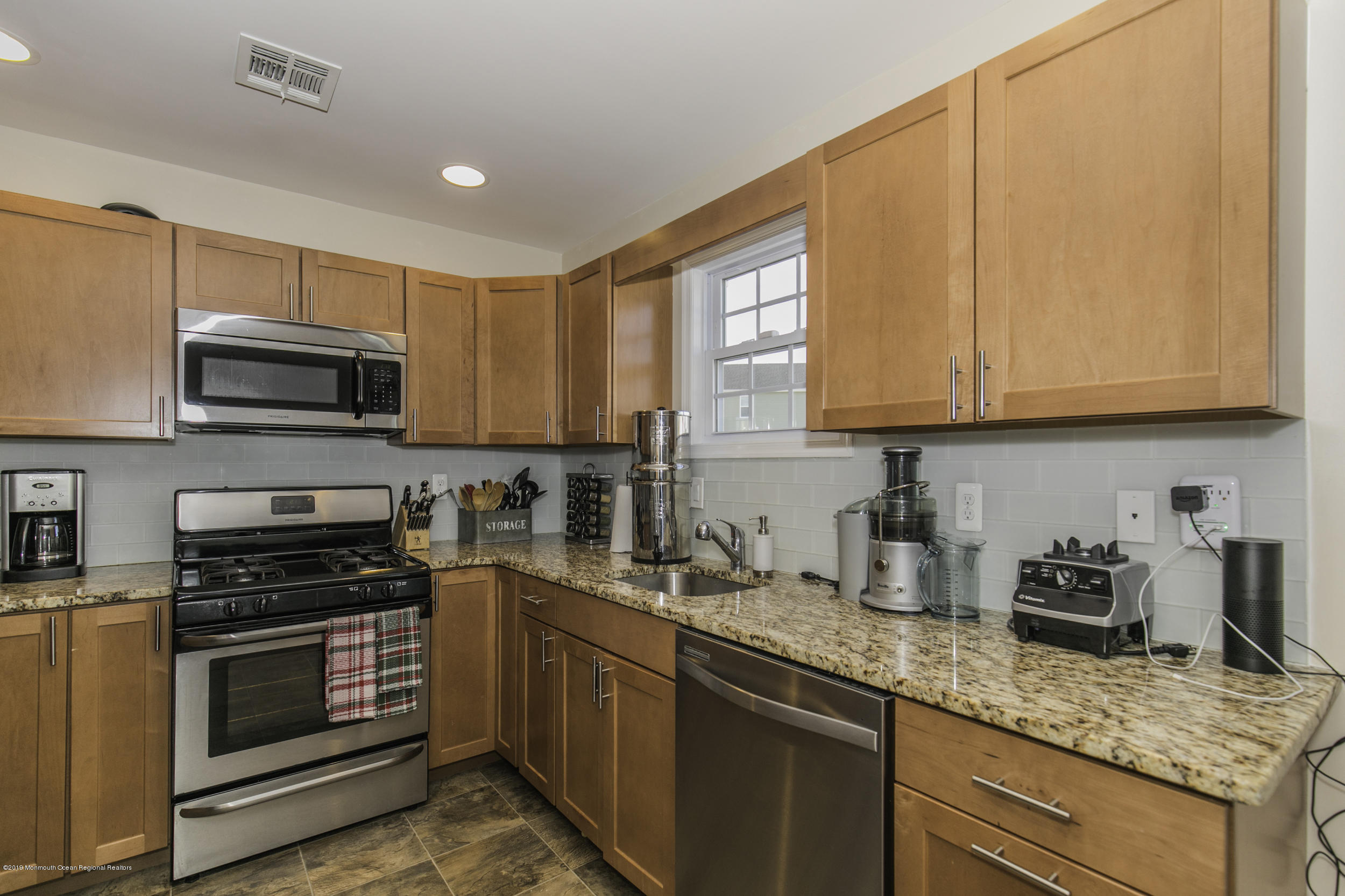 15 Seagoin Road Brick, NJ 08723 - Photo 12 of 32 a kitchen with granite countertop a sink cabinets stainless steel appliances and a counter space