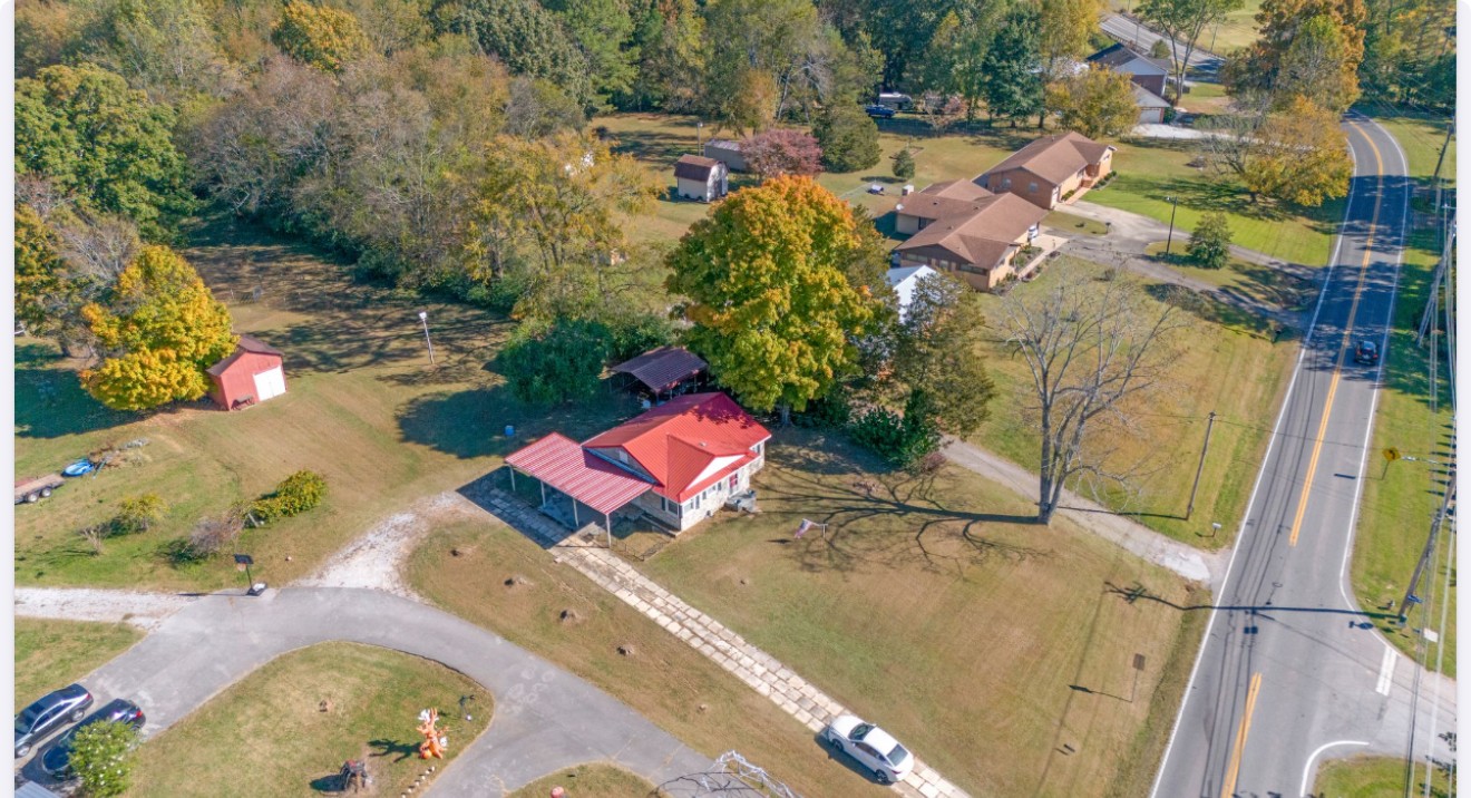 301 West Point Road Lawrenceburg, TN 38464 - Photo 6 of 31 an aerial view of a house with a yard