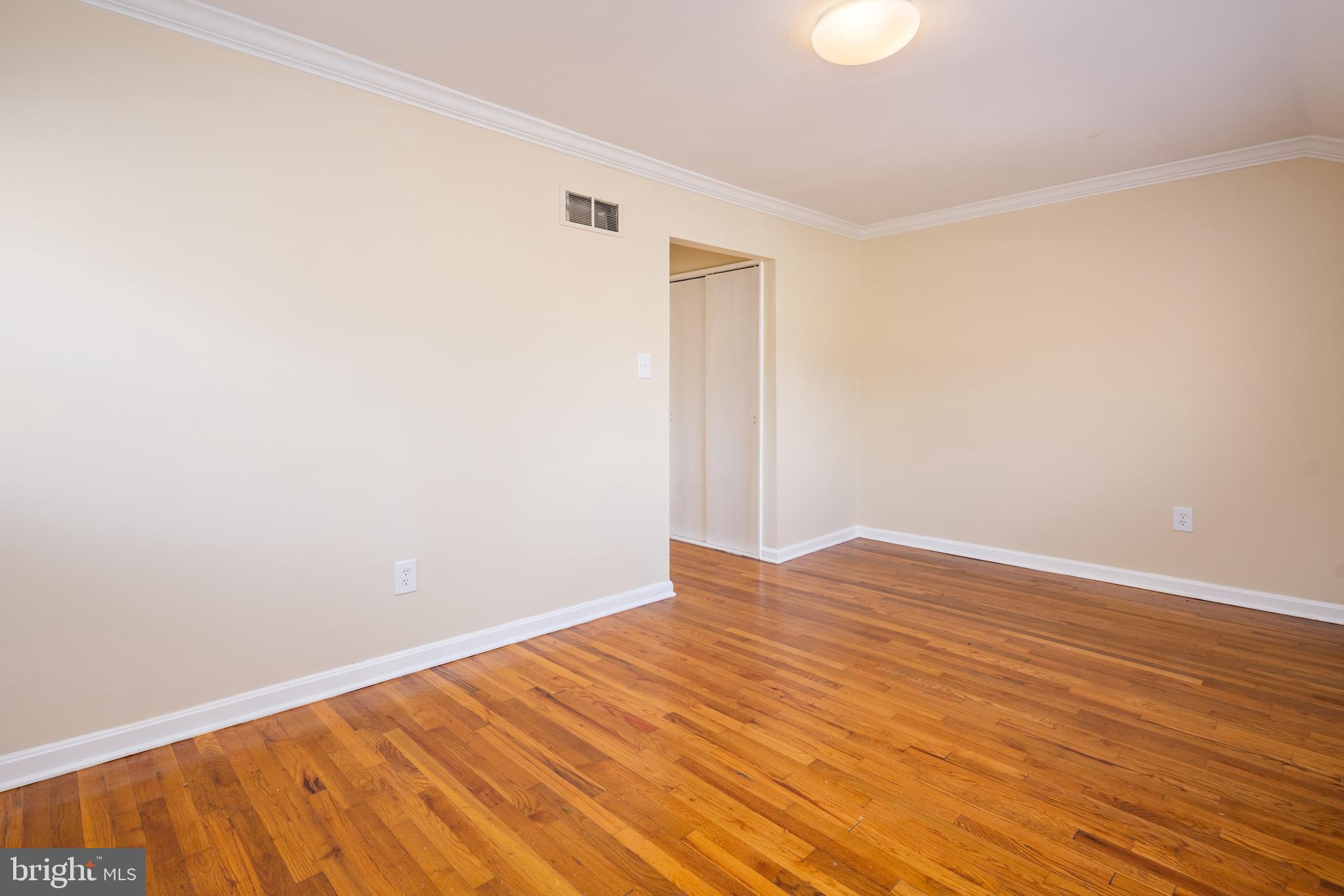 6319 Longfellow Street Riverdale, MD 20737 - Photo 18 of 40 a view of empty room with wooden floor