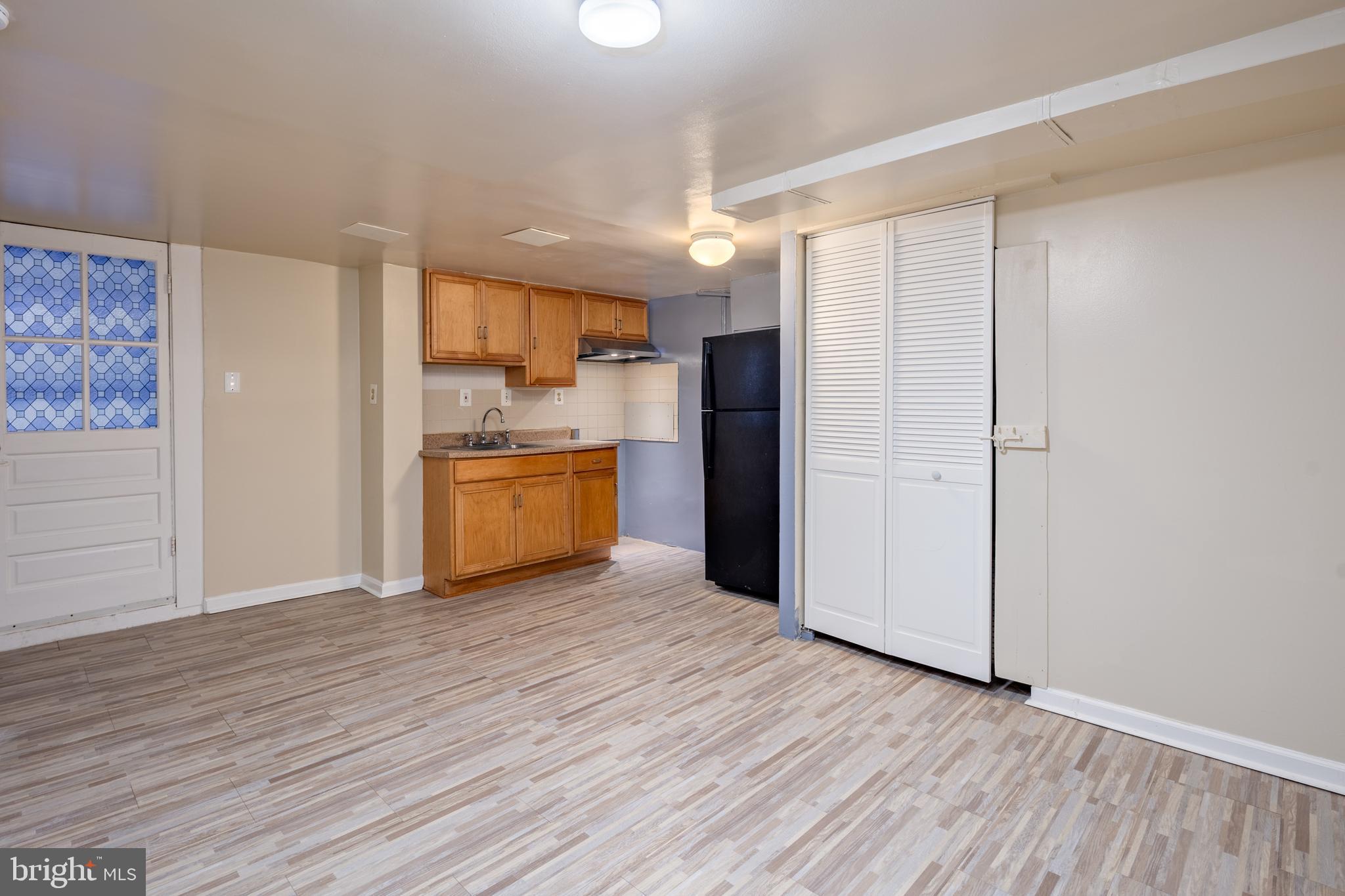 6319 Longfellow Street Riverdale, MD 20737 - Photo 26 of 40 a kitchen with stainless steel appliances a refrigerator and a stove top oven
