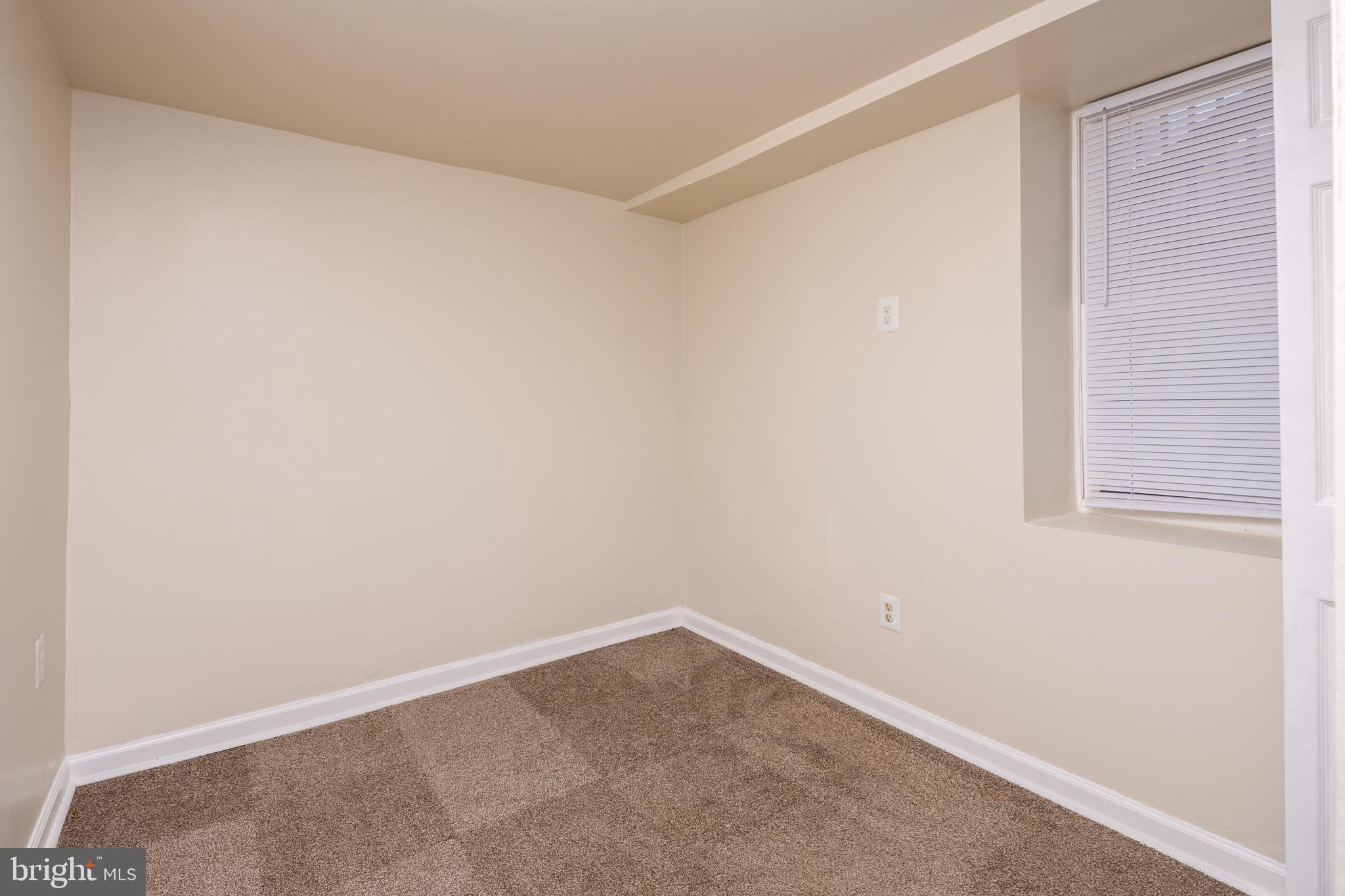 6319 Longfellow Street Riverdale, MD 20737 - Photo 29 of 40 a room that has a window in it