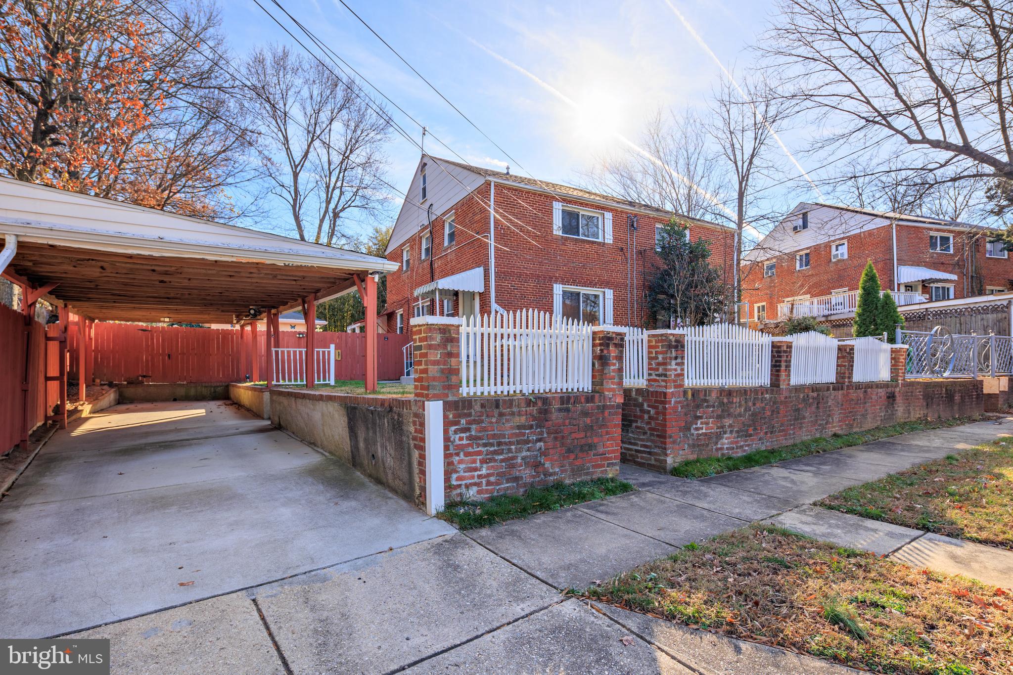 6319 Longfellow Street Riverdale, MD 20737 - Photo 40 of 40 a view of a building with a patio
