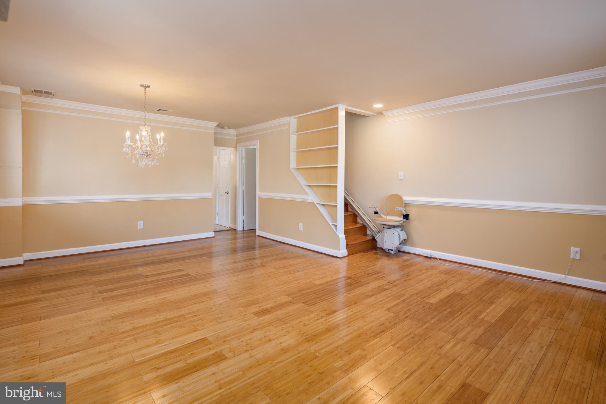 6319 Longfellow Street Riverdale, MD 20737 - Photo 4 of 40 an empty room with wooden floor and entryway