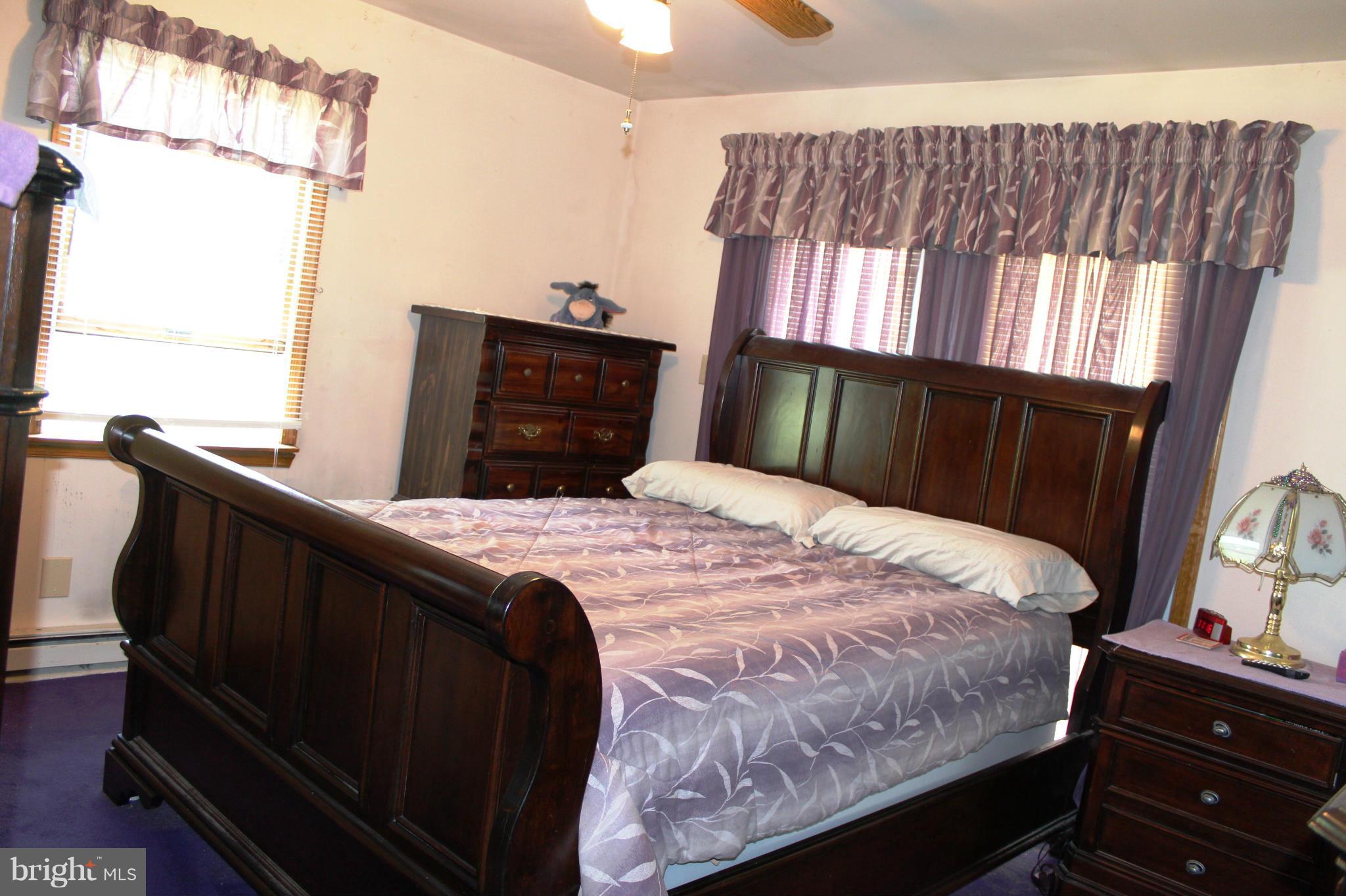 14565 Mercersburg Road Clear Spring, MD 21722 - Photo 13 of 15 a bedroom with a bed window and mirror