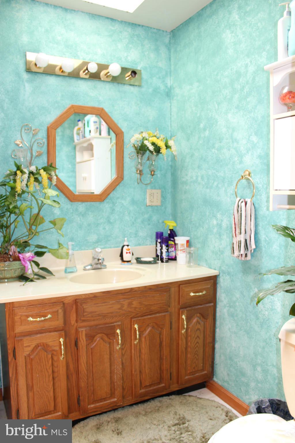 14565 Mercersburg Road Clear Spring, MD 21722 - Photo 14 of 15 a bathroom with a sink mirror and vanity