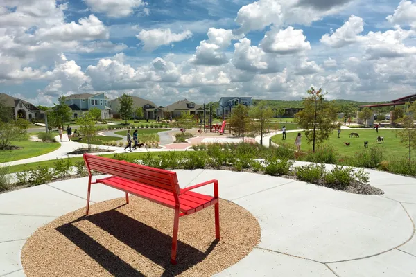 a park view with a bench in the garden