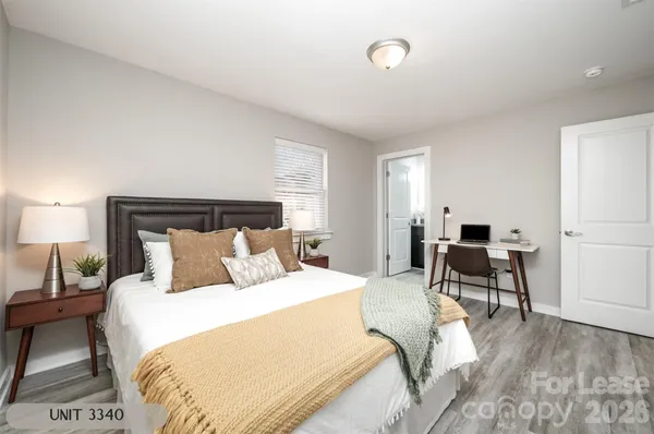 a bedroom with a bed and a couch
