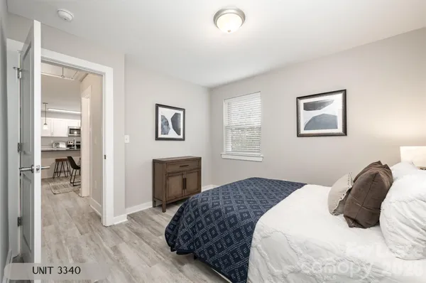 a bedroom with a bed and a couch