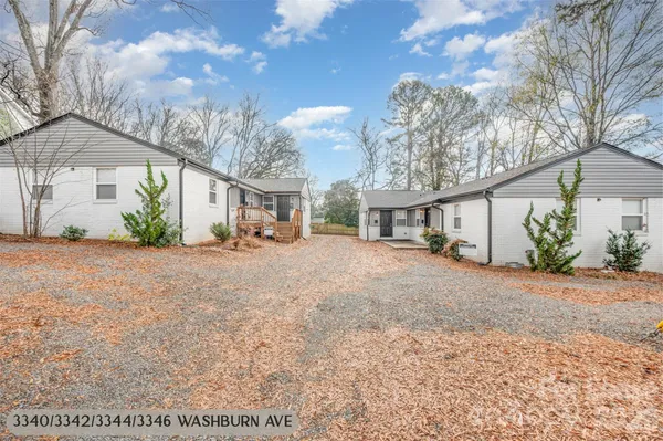 a view of a house with a yard and garage