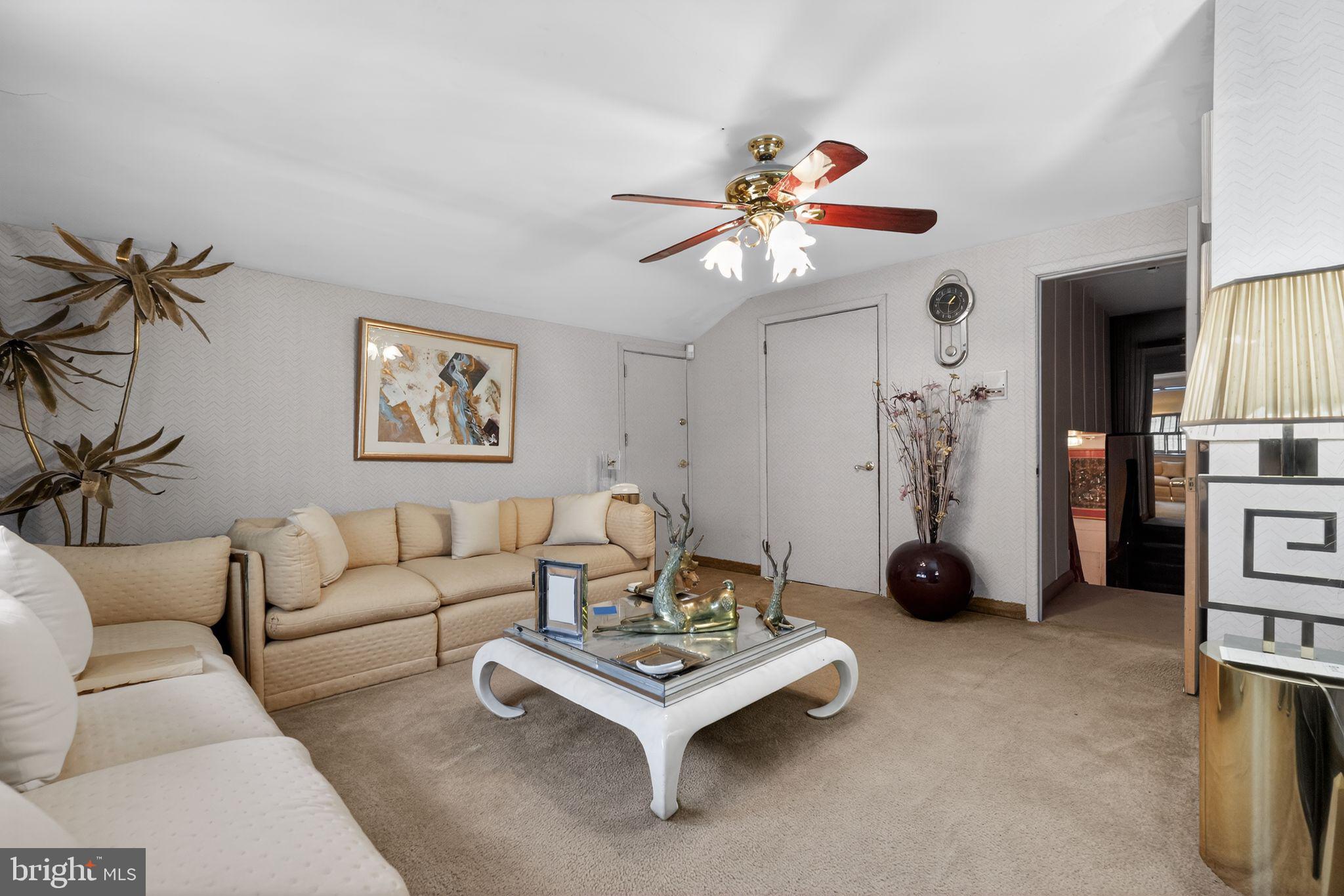 1912 Cobden Road Glenside, PA 19038 - Photo 11 of 30 a living room with furniture and a chandelier