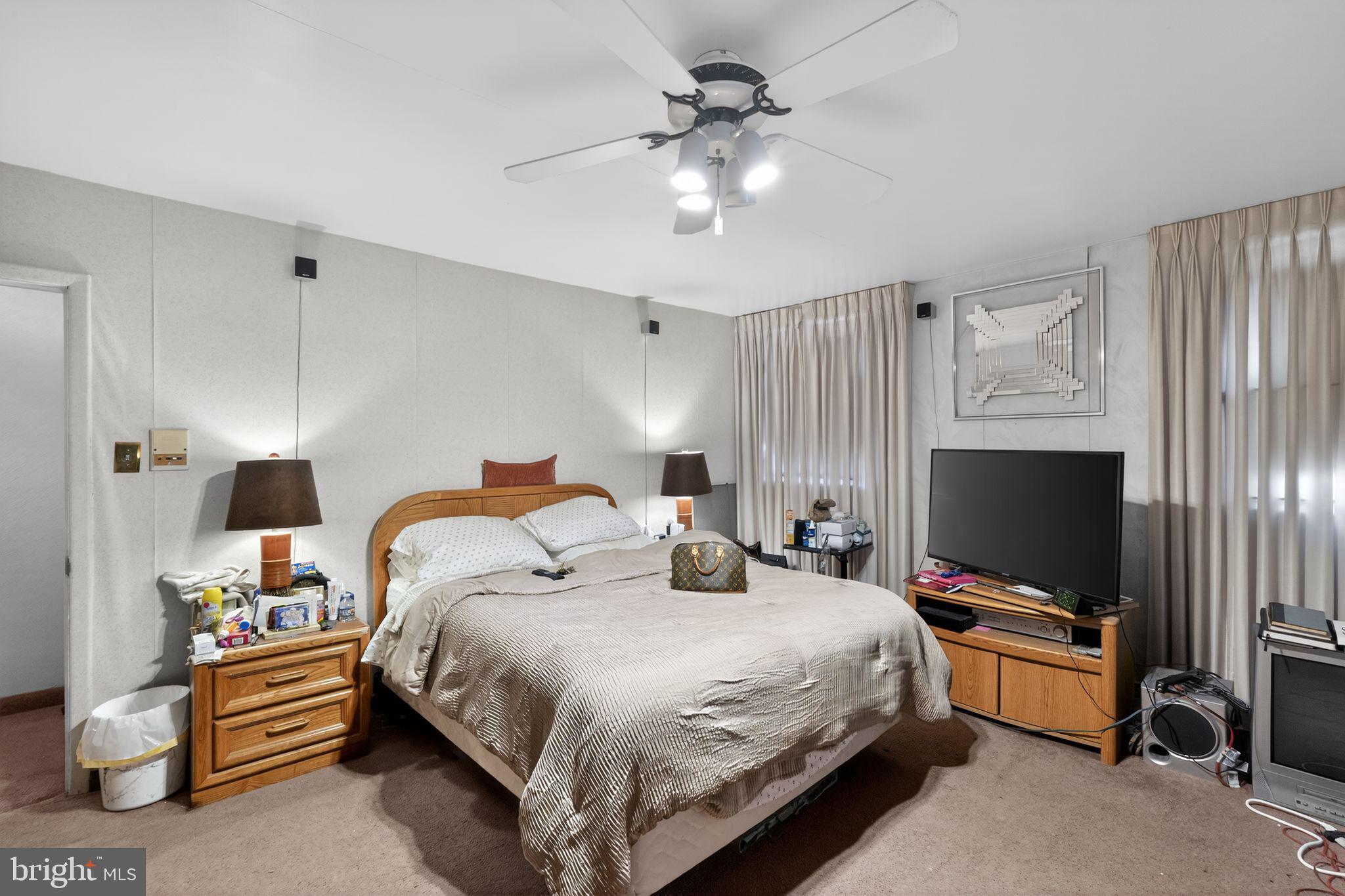 1912 Cobden Road Glenside, PA 19038 - Photo 19 of 30 a bedroom with a bed and a flat screen tv