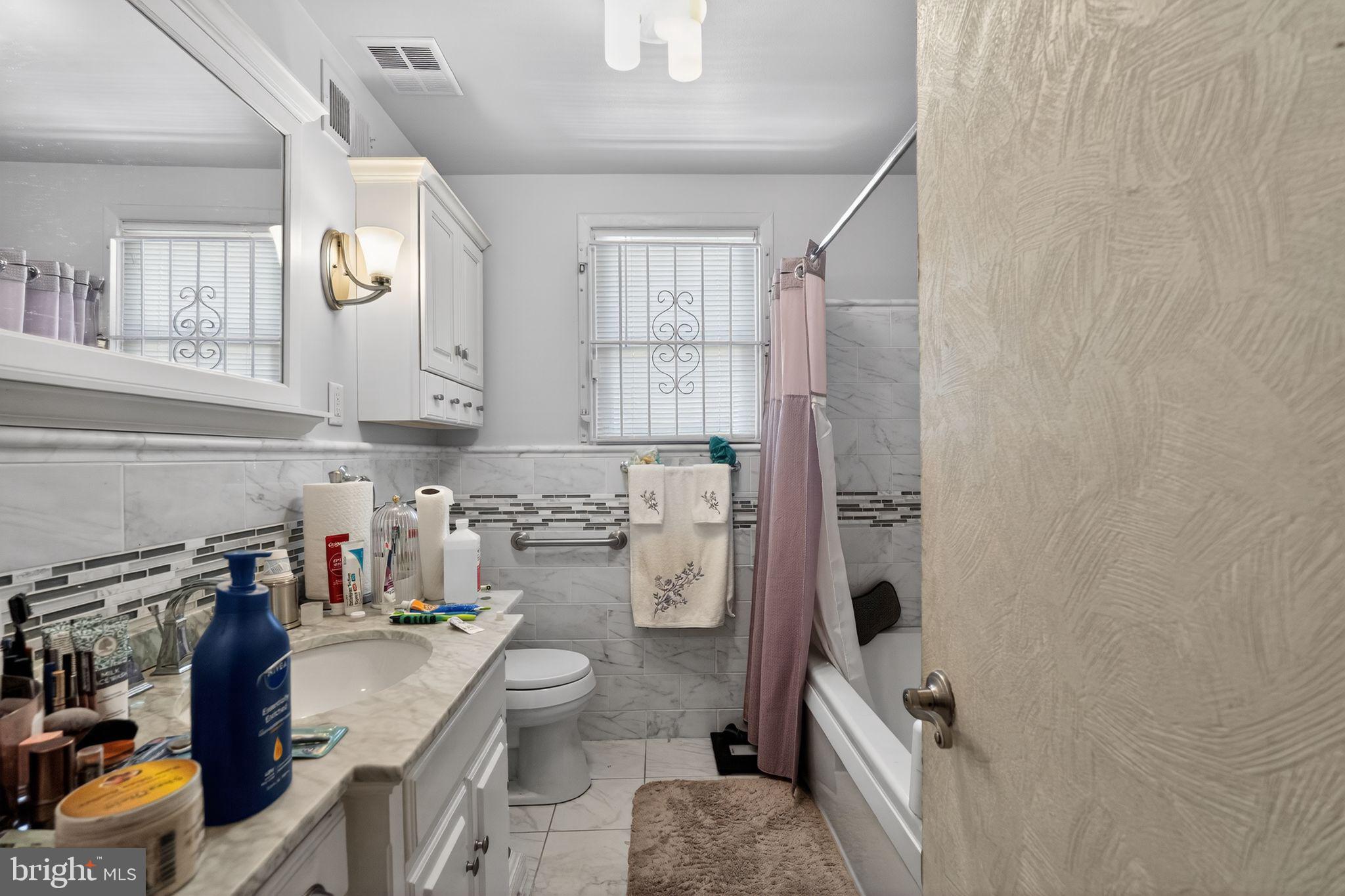 1912 Cobden Road Glenside, PA 19038 - Photo 20 of 30 a bathroom with a sink toilet and shower