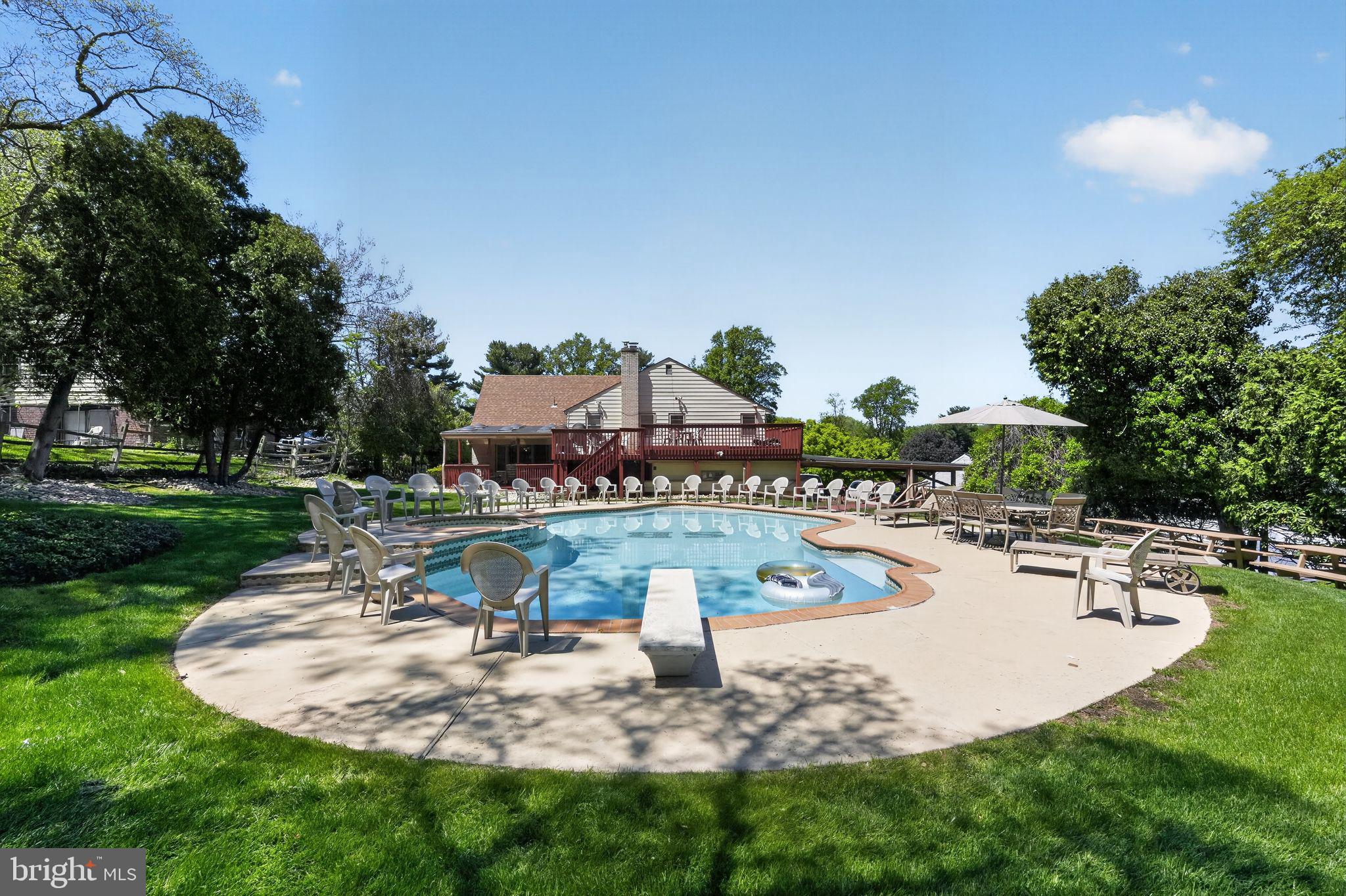 1912 Cobden Road Glenside, PA 19038 - Photo 2 of 30 a view of a swimming pool with a patio