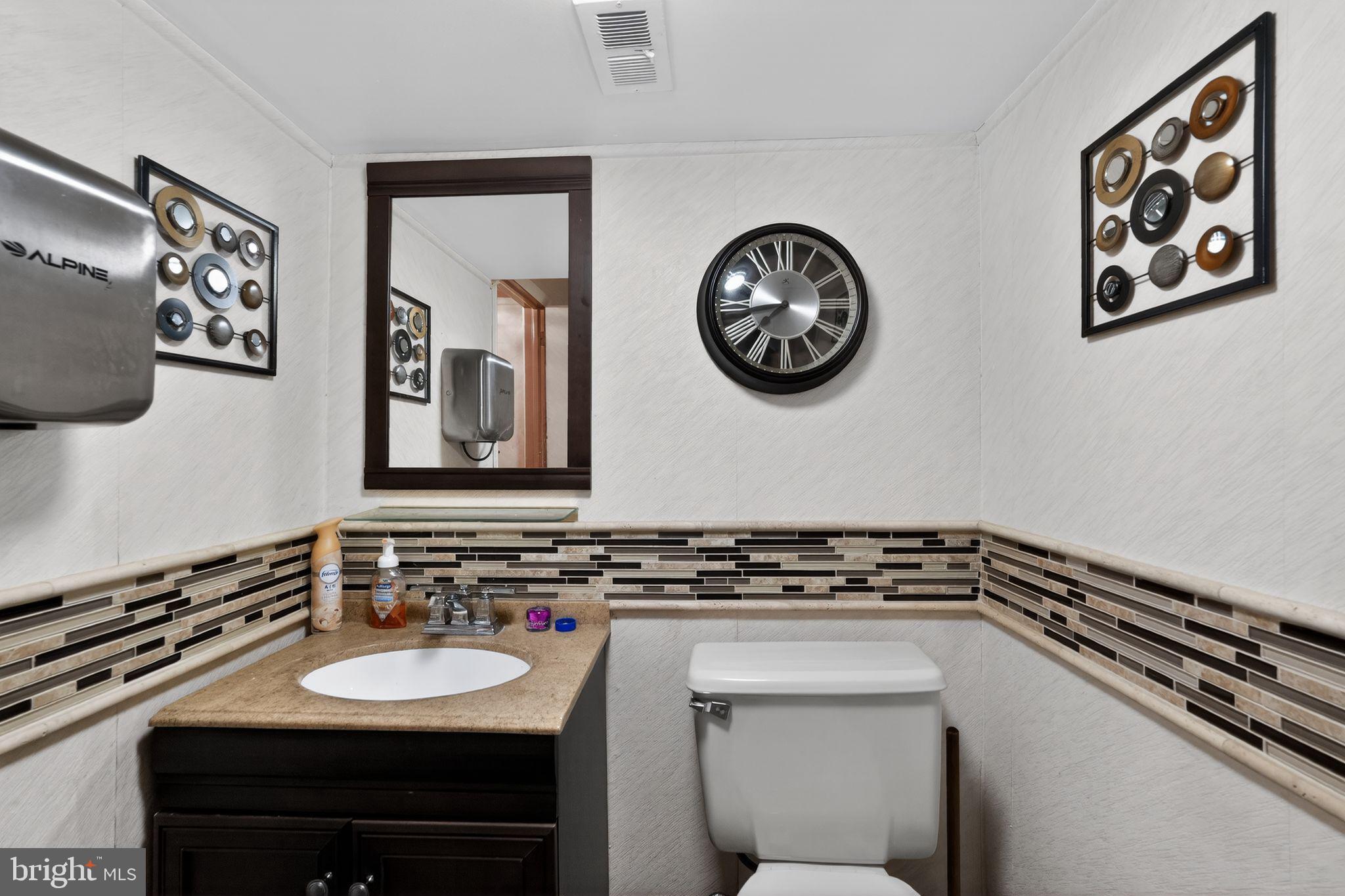 1912 Cobden Road Glenside, PA 19038 - Photo 21 of 30 a bathroom with a sink and a mirror
