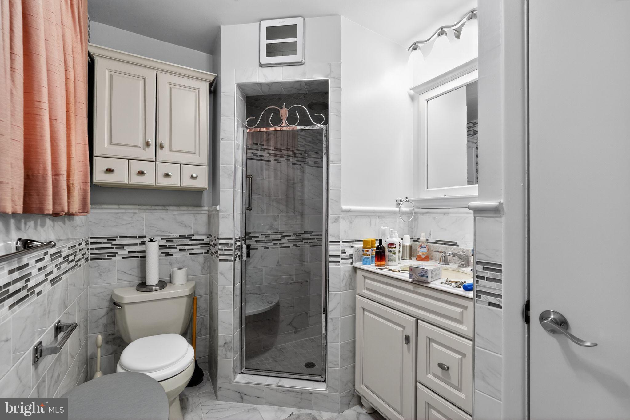 1912 Cobden Road Glenside, PA 19038 - Photo 23 of 30 a bathroom with a toilet sink and shower