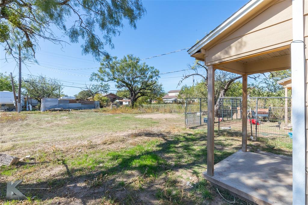 344 Southwest Ave A Hamlin, TX 79520 - Photo 18 of 19 a view of a backyard with wooden floor