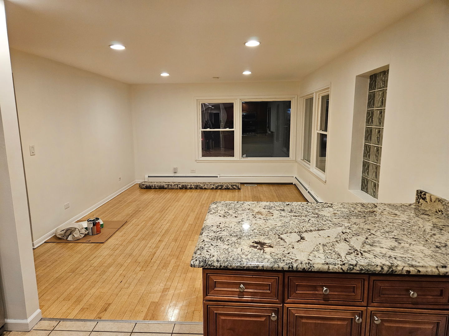 751 North Northwest Highway Park Ridge, IL 60068 - Photo 11 of 25 a view of a kitchen with kitchen island a sink wooden floor and glass windows