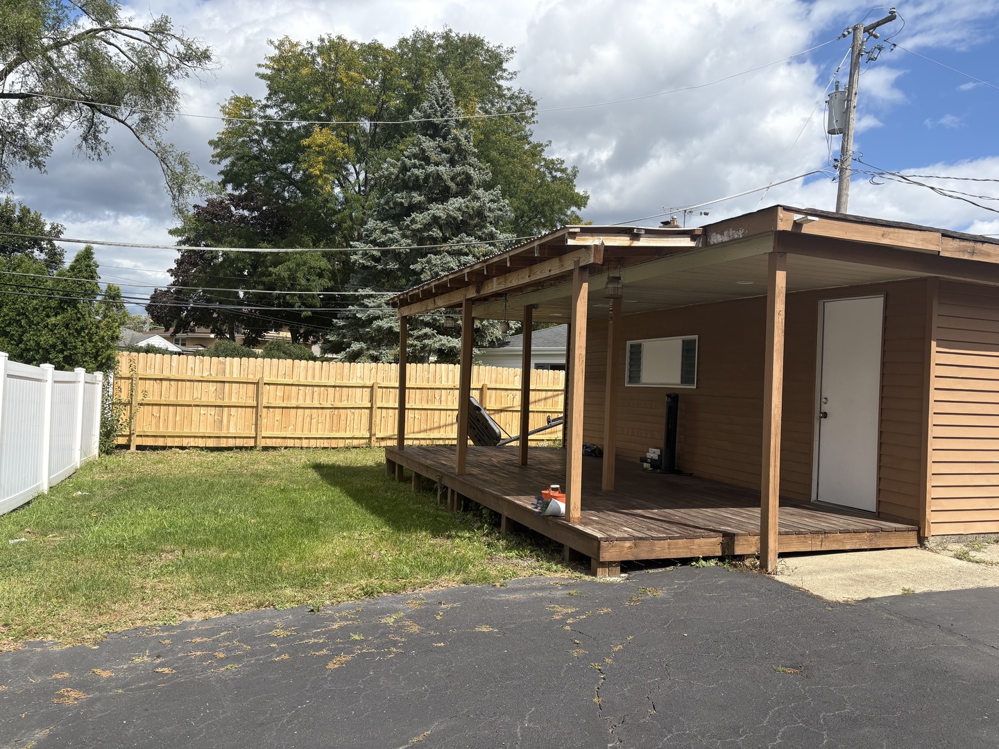 751 North Northwest Highway Park Ridge, IL 60068 - Photo 2 of 25 a view of a tiny house with wooden fence