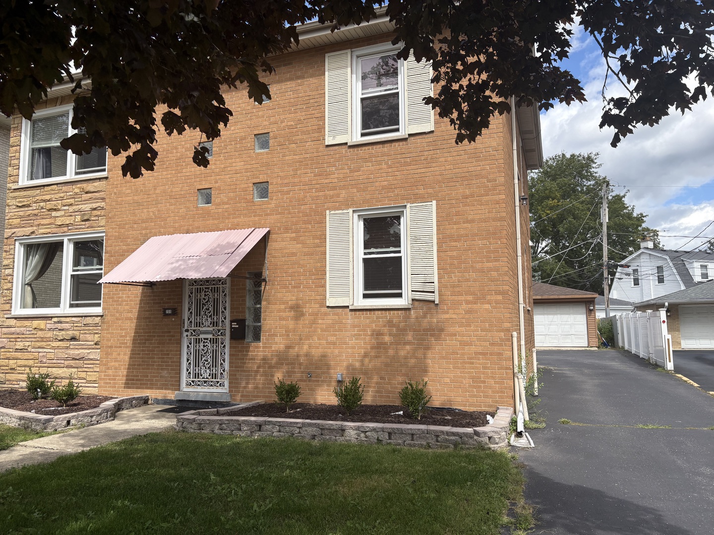 751 North Northwest Highway Park Ridge, IL 60068 - Photo 3 of 25 a front view of a house with a garden