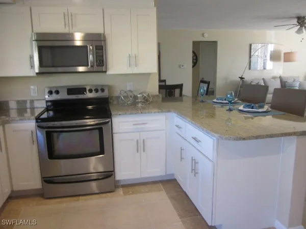 a kitchen with a stove and a microwave