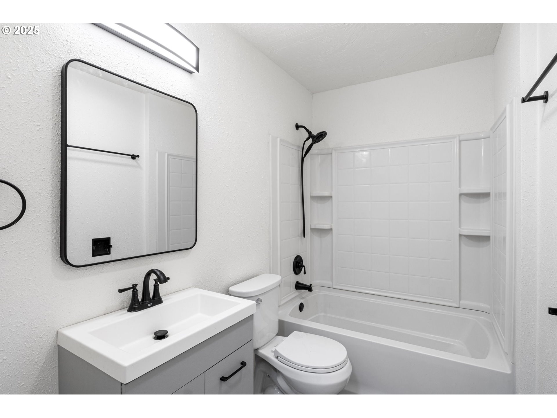 514 East 2nd Avenue Riddle, OR 97469 - Photo 12 of 16 a bathroom with a toilet sink and mirror