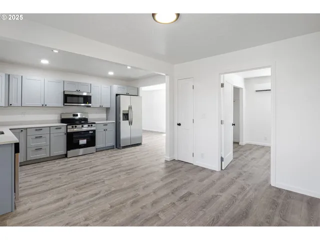 a view of kitchen with wooden floor
