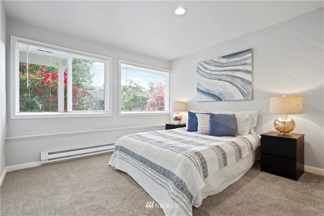 7579 Old Redmond Road, Unit 4 Redmond, WA 98052 - Photo 11 of 21 a bedroom with a bed and a large window