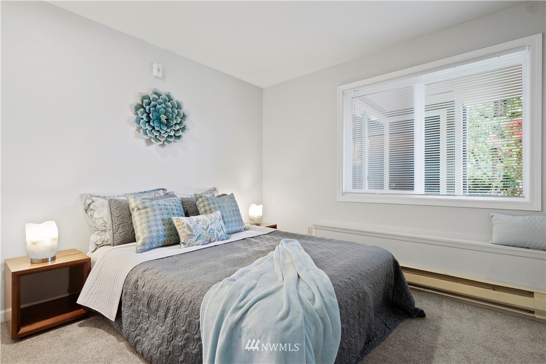 7579 Old Redmond Road, Unit 4 Redmond, WA 98052 - Photo 14 of 21 a bed sitting in a bedroom next to a window