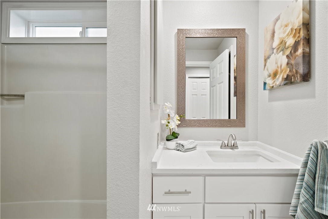 7579 Old Redmond Road, Unit 4 Redmond, WA 98052 - Photo 16 of 21 a bathroom with a sink and a mirror