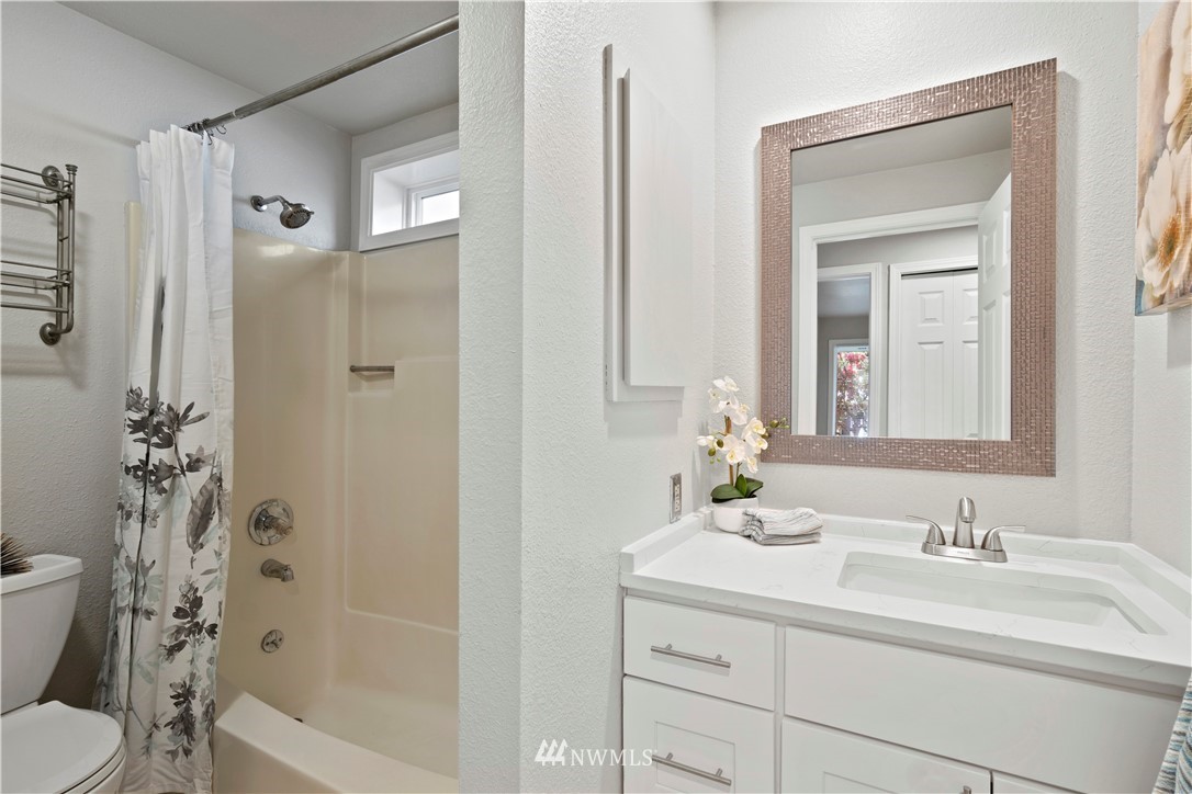 7579 Old Redmond Road, Unit 4 Redmond, WA 98052 - Photo 17 of 21 a bathroom with a sink a toilet and shower