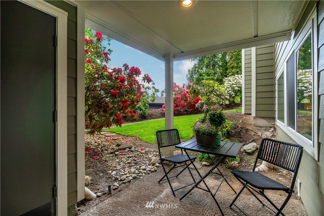 7579 Old Redmond Road, Unit 4 Redmond, WA 98052 - Photo 19 of 21 a view of a chairs and table in a backyard