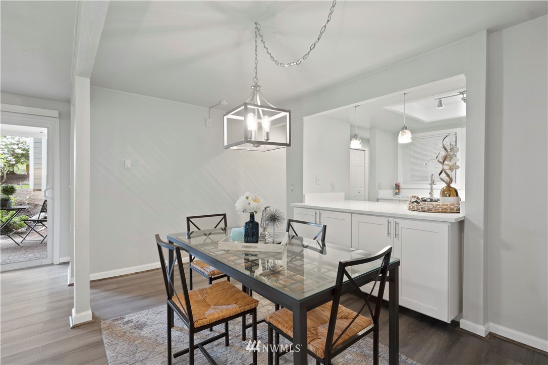 7579 Old Redmond Road, Unit 4 Redmond, WA 98052 - Photo 5 of 21 a view of a dining room with furniture and wooden floor
