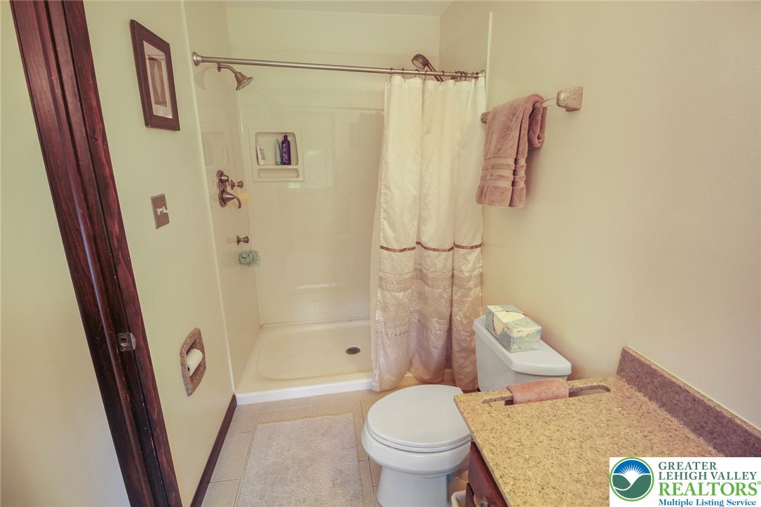 3470 Brodhead Road Bethlehem, PA 18020 - Photo 61 of 84 Functional bathroom featuring a shower, toilet, and vanity with ample counter space.