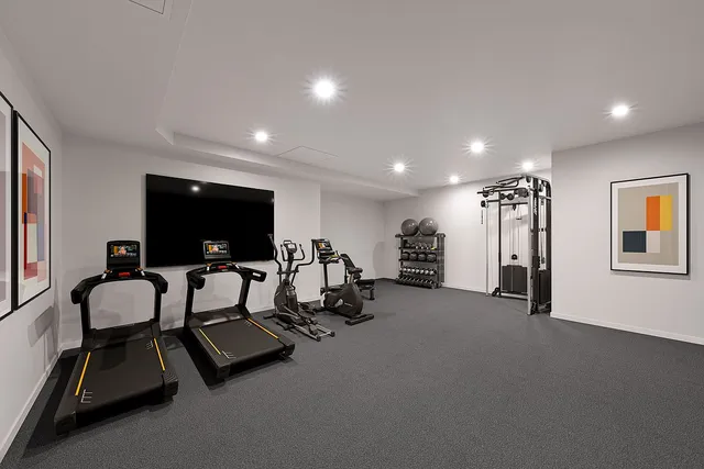 a living room with furniture a rug and a floor to ceiling window
