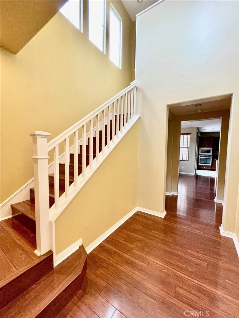 65 Sacred Path Irvine, CA 92618 - Photo 11 of 22 a view of an entryway with wooden floor and door