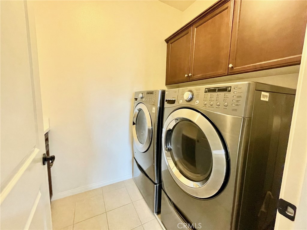 65 Sacred Path Irvine, CA 92618 - Photo 18 of 22 a utility room with dryer and washer