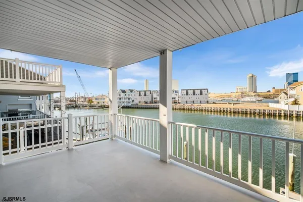 a view of a balcony and city view