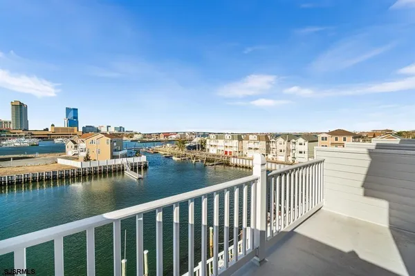 a living room with fireplace furniture and a wooden floor