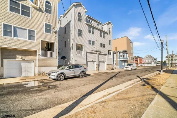 a bed room with a bed and a flat tv screen