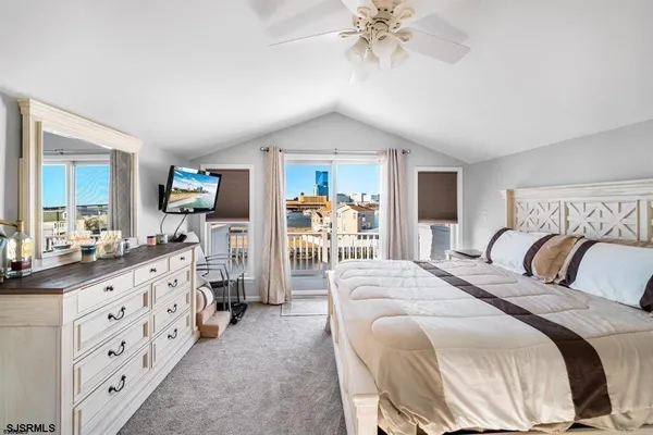 a bedroom with furniture and a window